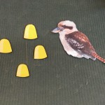 Photo of a kookaburra bird and several gumdrops.