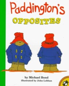 The cover of the book Paddington's Opposites. The illustration shows Paddington the bear facing forward next to himself facing backward.