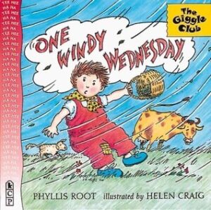 The cover of the book One Windy Wednesday. The illustration is of a strong wind blowing past a child holding a basket and a cow.